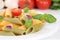 Colorful Penne Rigate noodles pasta meal with tomatoes and basil