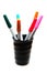 Colorful pens in black grass
