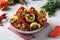 Colorful pepper stuffed with eggplant, onions and carrots on light gray background, Vegetarian food, Closeup