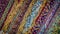 Colorful Persian rug edges with fringes lined up diagonally