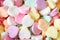 Colorful pile of pastel candy hearts for Valentine`s Day