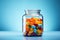 Colorful pills in a glass jar on wooden table with copy space