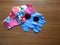 Colorful Pink, Blue, and Red Fabric Facemask, Disposable Gloves, and Sunglasses From Above