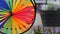 Colorful pinwheel spinning, weather wind vane, garden decoration in USA. Rainbow symbol of childhood, fantasy and imagination