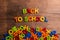 Colorful plastic letters, numbers, back to school, wooden backg