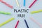 Colorful Plastic straws on a blue background and the inscription `Plastik free` The concept of a lifestyle based on the conscious