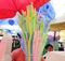 Colorful plastic straws in a street food shop