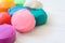 Colorful playdough on wooden table.