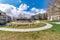 Colorful playground amidst apartment homes and walkways in scenic neighborhood