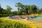 Colorful playground with sandpit for children on slope in sunny