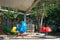 Colorful playground on yard in the park. Rocking horse and climbing rope for children in public park.