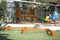 Colorful playground on yard in the park. Rocking horse, Slide and balance beam for children in public park