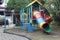 A colorful playhouse with some slides