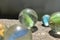 Colorful Playing Glass Balls. Glass blue ball. Abstract photo with Marble ball and reflection. Selective focus