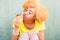 Colorful portrait of an african woman with sweet dessert