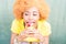 Colorful portrait of an african woman with sweet dessert