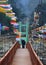 Colorful Prayer Flags Flutter Amid Tourists Enjoying Nature