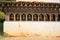 Colorful Prayer Wheels in Ancient Buddhist Temple, Bhutan