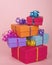 Colorful present boxes with ribbon stacked asymmetrically