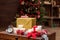 Colorful presents and decorative holiday things on wood surface