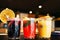 Colorful punch drinks on bar, close-up