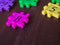 Colorful puzzle Jigsaw plastic number on the wooden table. Concept of education and math learning.