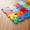 Colorful Puzzle Pieces Perfectly Interlocking on Polished Wooden Surface