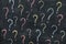 Colorful question marks on chalkboard background