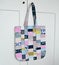 Colorful quilted patchwork tote bag and white wardrobe