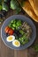 Colorful quinoa buddha plate withbroccoli, egg, spring onion, tomatoes and green peas. Home made food. Concept for a tasty and