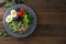 Colorful quinoa buddha plate withbroccoli, egg, spring onion, tomatoes and green peas. Home made food. Concept for a tasty and