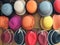 Colorful Rainbow Collection of Hats in Retail Store Display in Oranges, Blues, Reds, Yellows and Purples