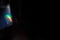 colorful rainbow crystal light leaks on black background