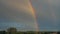 Colorful Rainbow Over Scenic Countryside Timelapse
