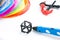 Colorful rainbow plastic filaments with for 3D pen laying on white. New toy for child. 3d paintings and figures with their own han