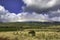 Colorful rainbow stretching across the west Maui mountains.