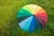 Colorful Rainbow Umbrella over a Green Grass Field Sunrisez Copy Space Spring Summer Rain