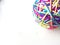Colorful rainbow yarn ball cat toy white background pink yarn bright