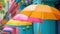 Colorful raindrops, umbrellas, and radiant hues create a cheerful spring display