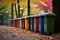 colorful recycling bins lined up in a park