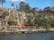 Colorful red sports figures by the water under Kangaroo Point Cliffs on the south side of the River Brisbane QLD Australia Septemb