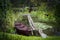 Colorful red wooden rowboat in a tranquil lake