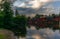 The colorful red wooden warehouses of Porvoo in Finland reflecting in the river at sunset during a warm summer evening - 1