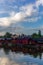 The colorful red wooden warehouses of Porvoo in Finland reflecting in the river at sunset during a warm summer evening - 10