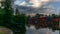 The colorful red wooden warehouses of Porvoo in Finland reflecting in the river at sunset during a warm summer evening - 2