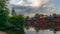 The colorful red wooden warehouses of Porvoo in Finland reflecting in the river at sunset during a warm summer evening - 5