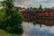 The colorful red wooden warehouses of Porvoo in Finland reflecting in the river at sunset during a warm summer evening - 8