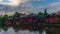 The colorful red wooden warehouses of Porvoo in Finland reflecting in the river at sunset during a warm summer evening - 9