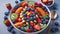 A colorful refreshing bowl of fruit salad with seasonal fruits