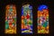 Colorful religious scene on stained glass windows inside the Cathedral of  Malaga, Andalusia, Spain